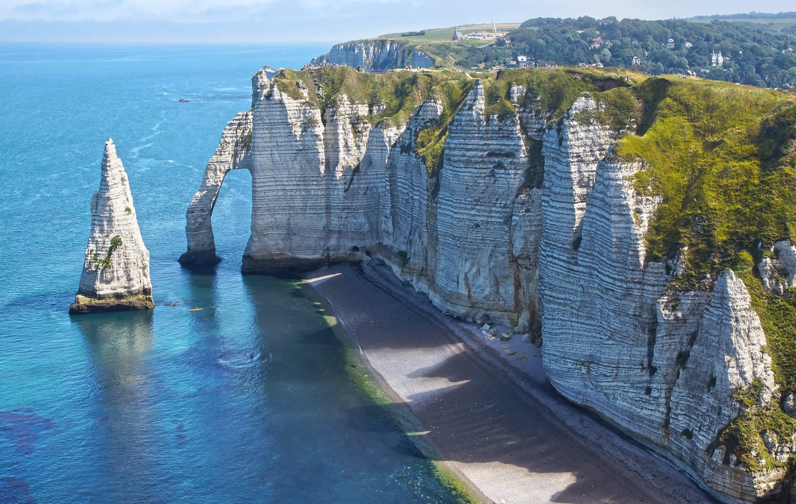 <p class="wp-caption-text">Image Credit: Shutterstock / Igor Plotnikov</p>  <p>The dramatic natural arches and pointed needle of Étretat offer a majestic seaside view, inspiring artists and travelers for generations.</p>