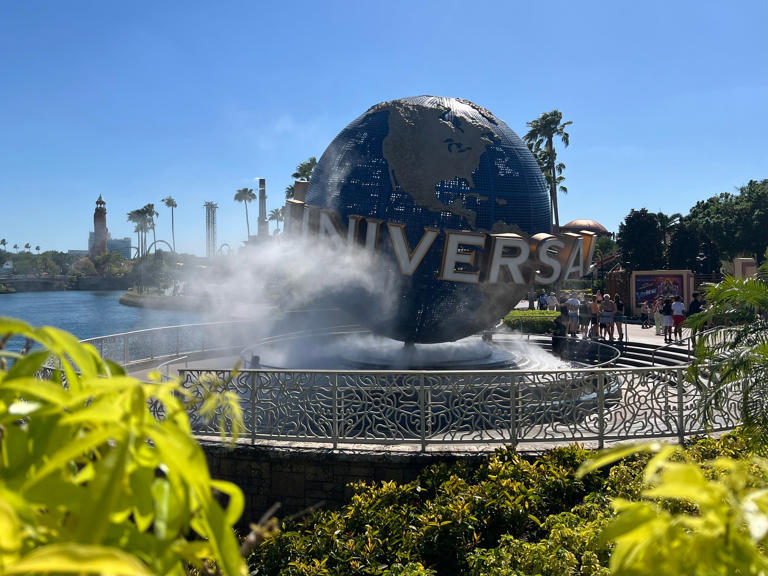 Universal Studios' iconic globe spins outside of Universal Studios Florida.