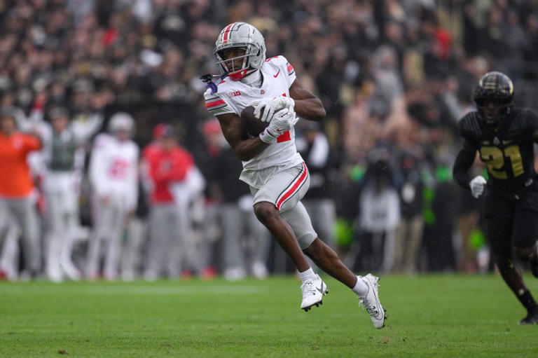 Buckeyes WR Carnell Tate pushes forward through his grief after mom’s death