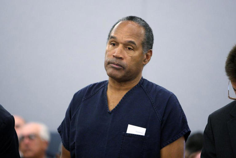 O.J. Simpson stands during sentencing at the Clark County Regional Justice Center, Dec. 5, 2008, in Las Vegas, Nevada.