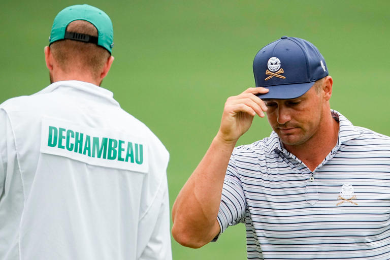 Apr 11, 2024; Augusta, Georgia, USA; Bryson DeChambeau tips his hat after putting on no. 2 during the first round of the Masters Tournament. Mandatory Credit: Adam Cairns-USA TODAY Network