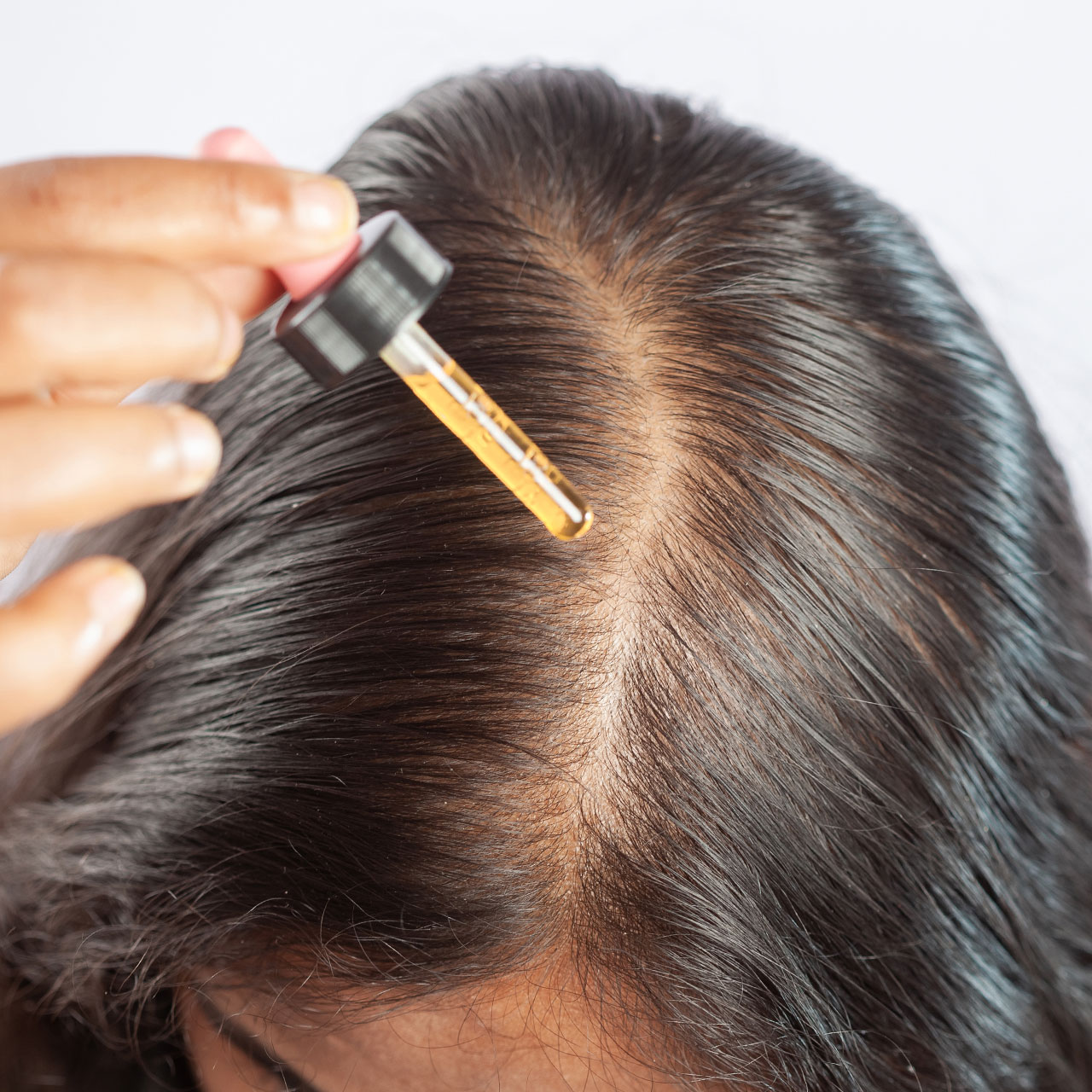 Doctors Share 6 Strengthening Hair Oils For Healthy Volume & Thickness