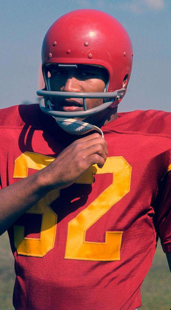 O.J. Simpson #32 of the University of Southern California Trojans looks on from the sidelines during an NCAA college football game circa 1968.