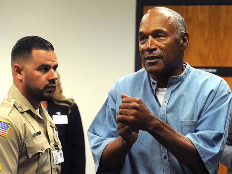 O.J. Simpson (C) reacts after learning he was granted parole at Lovelock Correctional Center July 20, 2017 in Lovelock, Nev.