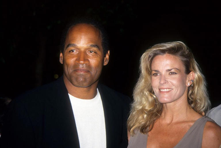 O.J. Simpson and Nicole Brown Simpson pose at the premiere of the "Naked Gun 33 1/3: The Final Isult" in which O.J. starred on March 16, 1994 in Los Angeles.
