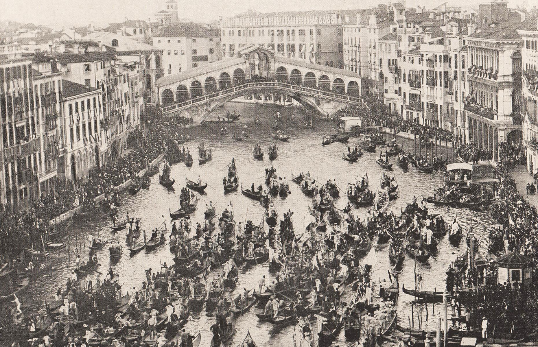 <p>Even before 30 million visitors began descending upon Venice each year, this magical city on the water was accustomed to crowds. Here we see gondolas crammed in front of the Rialto Bridge to celebrate one of the city’s fete days in 1895. These flat-bottomed boats were once colorful and richly decorated but a law passed in the 16th century stated that all gondolas must be painted black, as competition between the local nobles to have the fanciest boat was deemed unseemly, and they remain that shade to this day.</p>