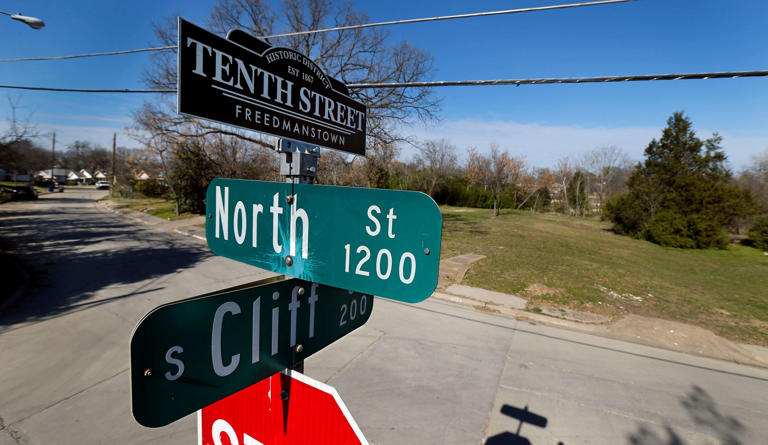 A street sign topper reminds residents of the historic Tenth Street Freedmanstown east of I-35E in the Oak Cliff area of Dallas, Monday, January 28, 2019.