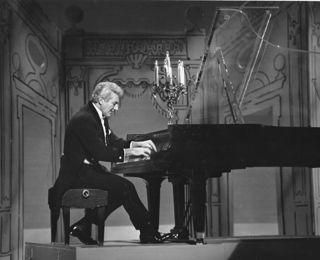 <p>Viewers were never certain what they'd see when they tuned in to watch <i>The Ed Sullivan Show</i>. One favorite guest was the flamboyantly flashy pianist Liberace. </p> <p>During his appearances on the show (there were six performances total), Liberace performed a few songs, did some comedy bits, and even taught Sullivan to play the piano. The show included a highly-specialized symphony orchestra. The gig was extremely demanding, as they had to adjust to the wide variety of guest artists on the show.</p>