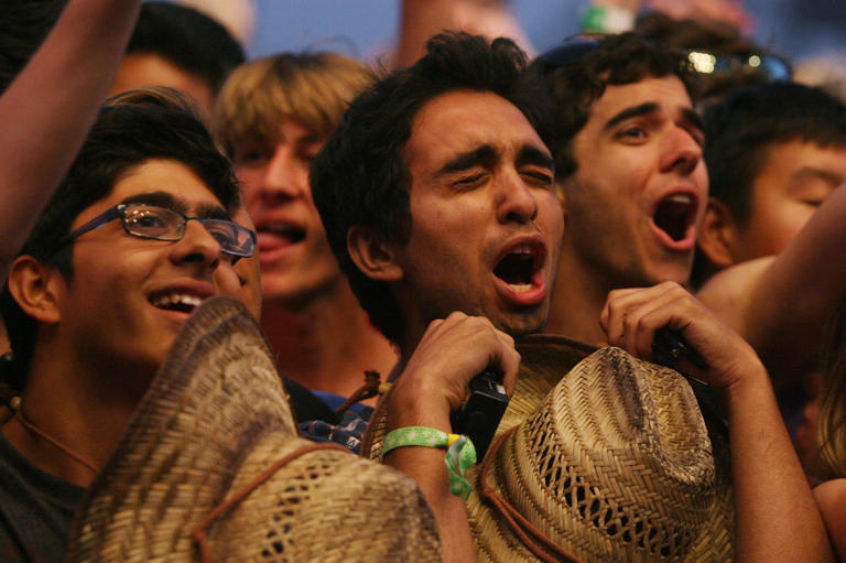 Fans sing along as Vampire Weekend performs on the Main Stage during the Coachella Valley Music and Arts Festival at the Empire Polo Fields in 2013 in Indio, Calif.