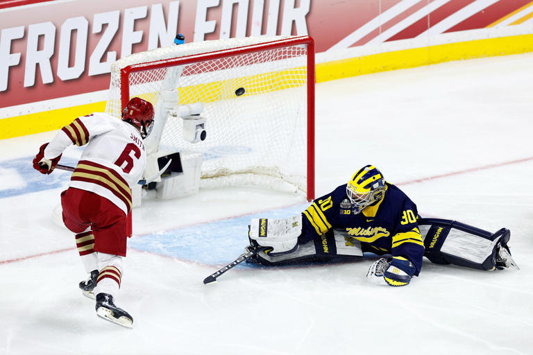 Boston College's Will Smith buries the open-net goal in the first period, which gave the Eagles a 1-0 lead over Michigan in the NCAA men's hockey semifinals.