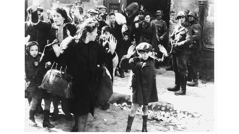 A group of Jewish civilians being held at gunpoint by German SS troops after being forced out of a bunker where they were sheltering during the Warsaw Ghetto Uprising in German-occupied Poland, World War II, April 19 - May 16, 1943. Getty Images