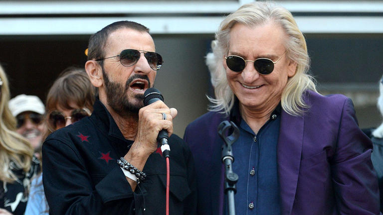 Ringo Starr, left, of The Beatles and Joe Walsh of the Eagles celebrate Starr's 77th birthday at Capitol Records Tower on July 7, 2017, in Los Angeles, California. Starr recorded a remake of 1955 landmark hit "(We're Gonna) Rock Around the Clock" in 2021, featuring Walsh on guitar. Getty Images