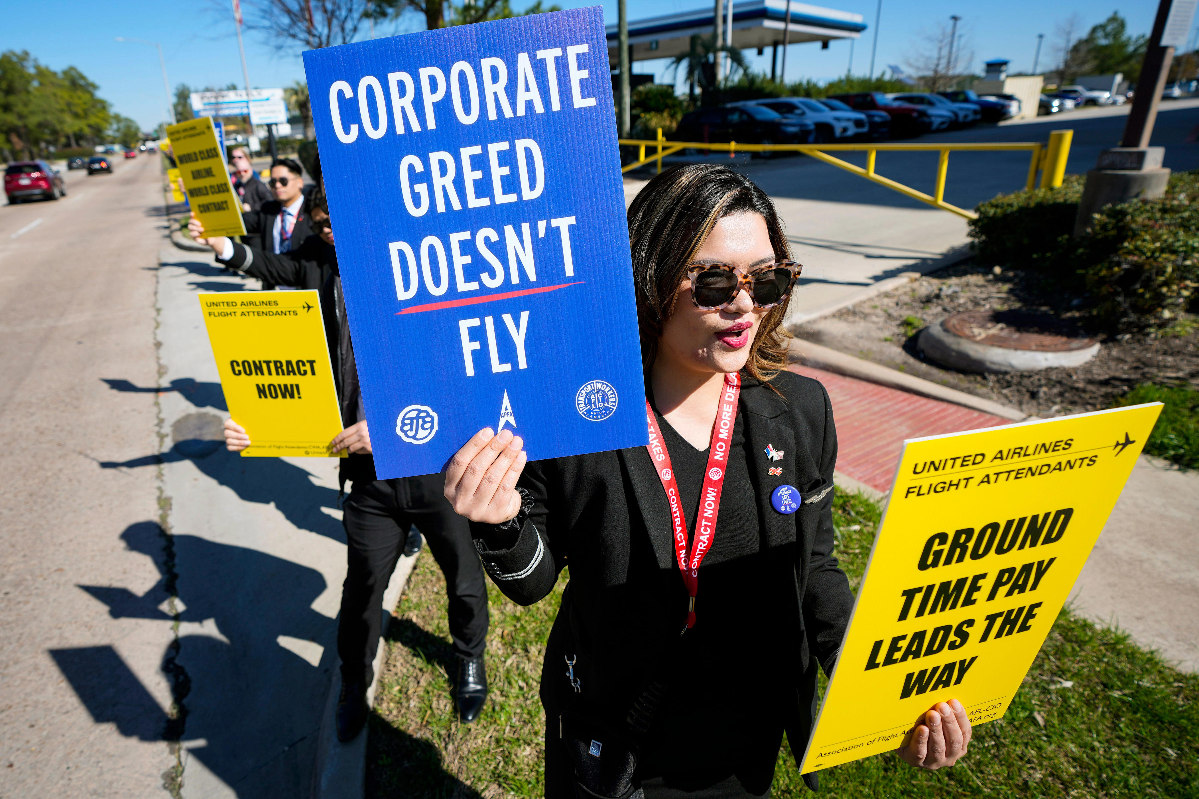 microsoft, united airlines flight attendants picketed at over a dozen airports worldwide after the ceo received a 90% pay increase
