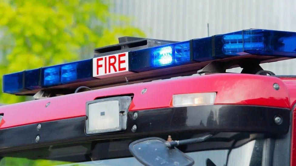 Three hurt after mobile home and cars set on fire