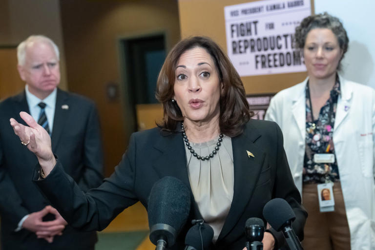 Vice President Kamala Harris speaks to the media after touring Planned Parenthood, behind her are Gov. Tim Walz and Planned Parenthood North Central States Chief Medical Officer Sarah Traxler, MD. Thursday, March 14, 2024, in St. Paul, Minn.