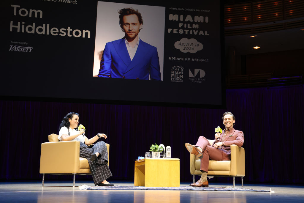tom hiddleston reflects on breakthrough loki role, thanks co-stars across his career for ‘sharing the dream' of acting at miami film festival