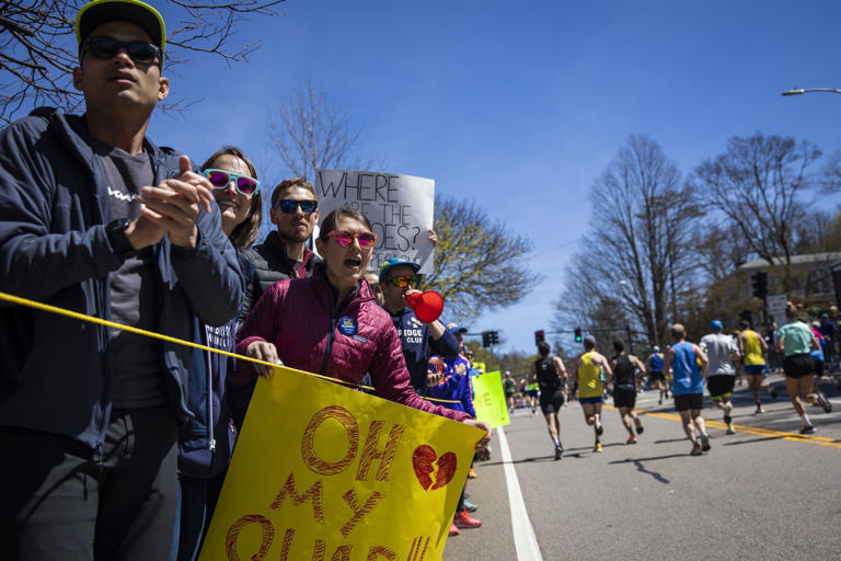 Members of Cambridge Running Club cheered on runners on April 18, 2022 as they reached the top of Heartbreak Hill during the 126th running of the Boston Marathon.
