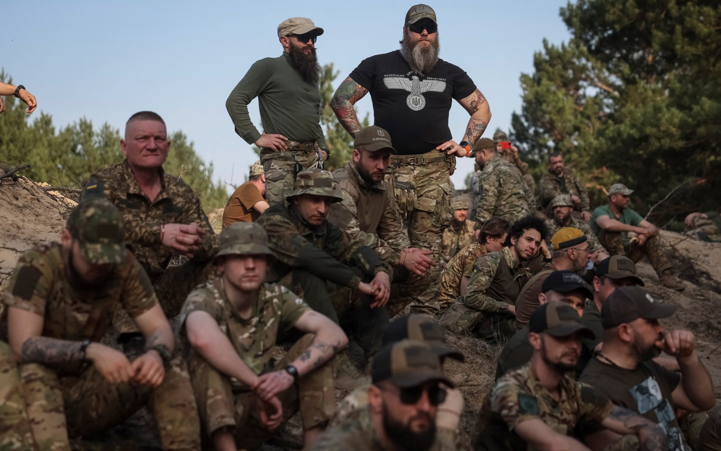 pictured: ukraine soldiers relax on a break from brutal fighting on the front line