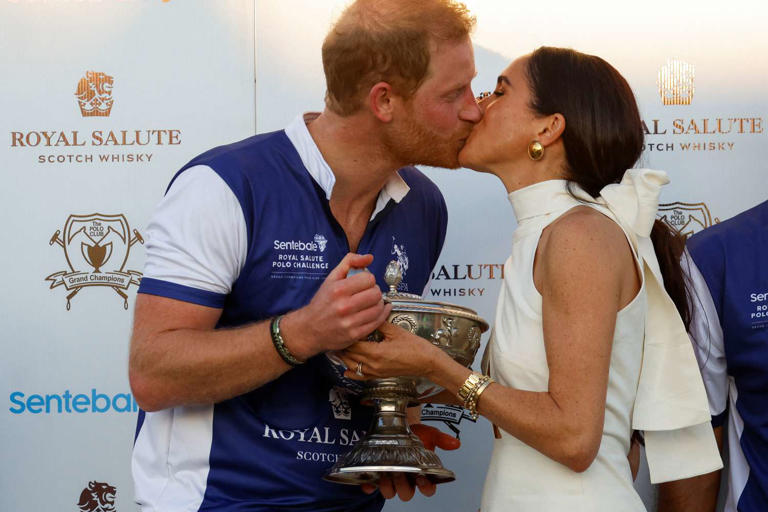 REUTERS/Marco Bello Prince Harry and Meghan Markle kiss at the Royal Salute Polo Challenge to benefit Sentebale in Wellington, Florida, on April 12, 2024.