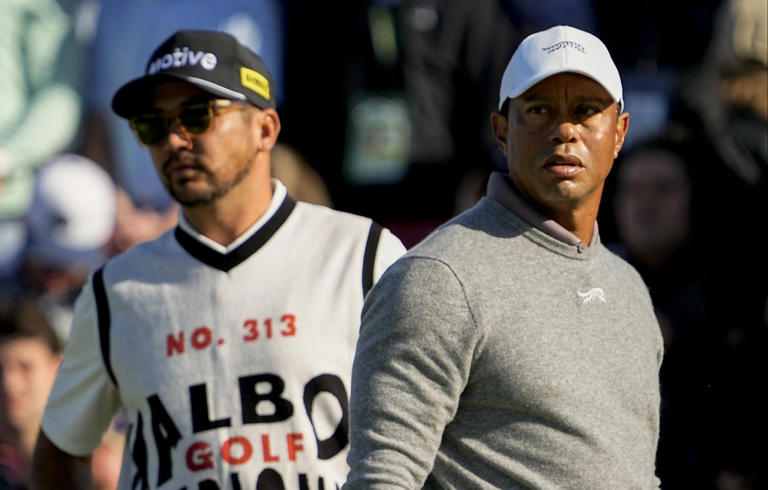 Tiger Woods and Jason Day check the scoreboard after finishing on no. 18 during the completion of the first round of the Masters Tournament. (Photo: Adam Cairns-USA TODAY Network)