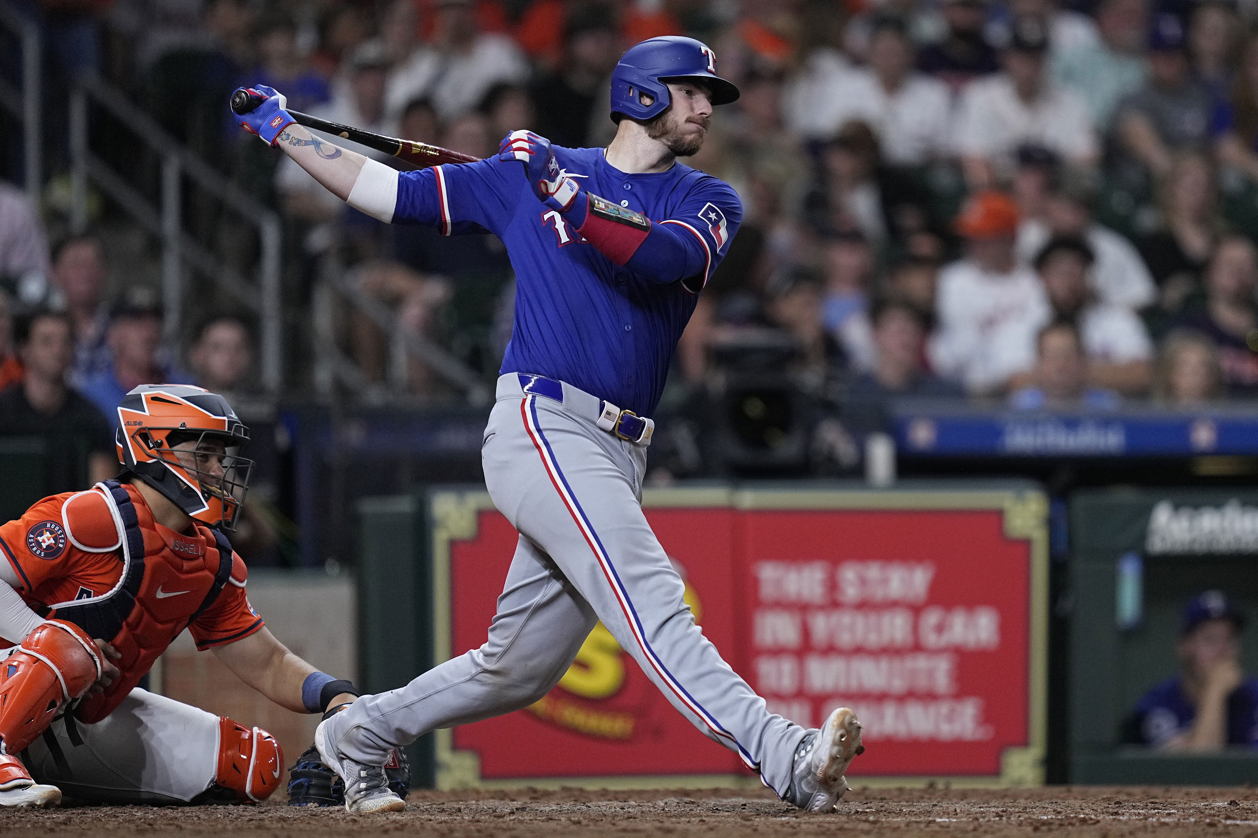 heim homers with 4 rbis as rangers win 12-8 and drop astros to to 4-11