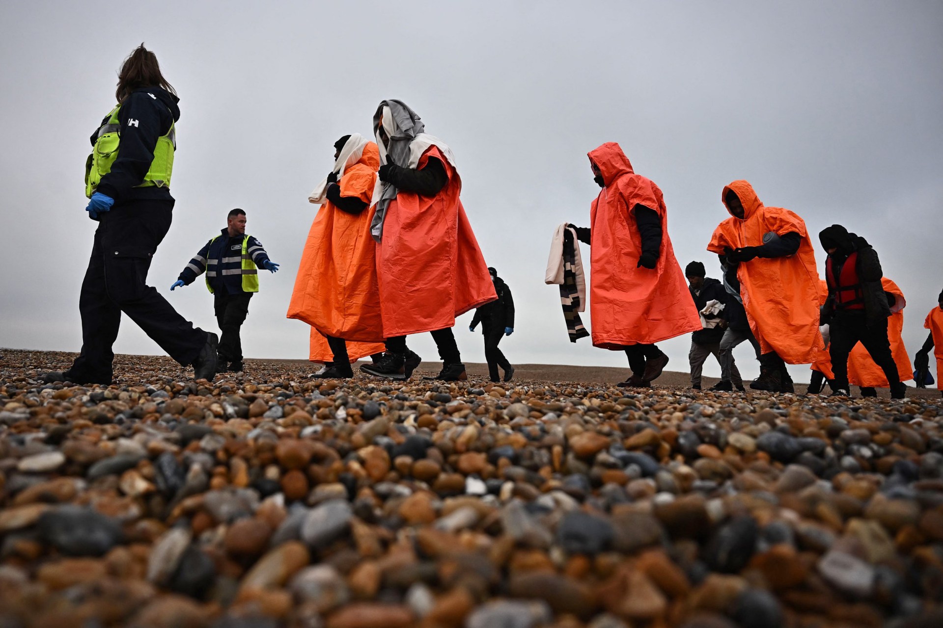 british rescuers save migrants in ‘grave danger’ as french look on