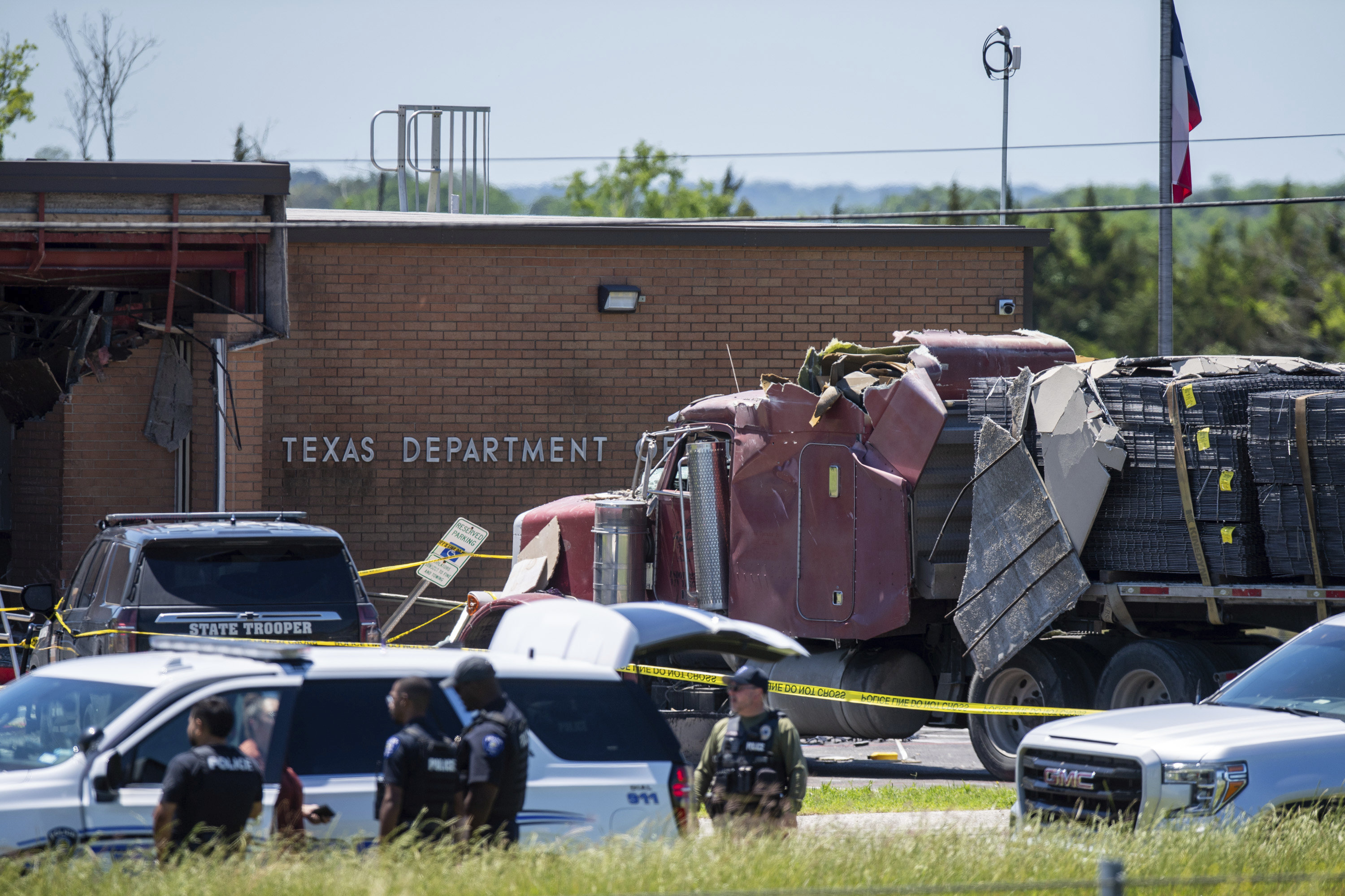 1 killed, 13 hurt after driver rams truck into tex. state agency, officials say
