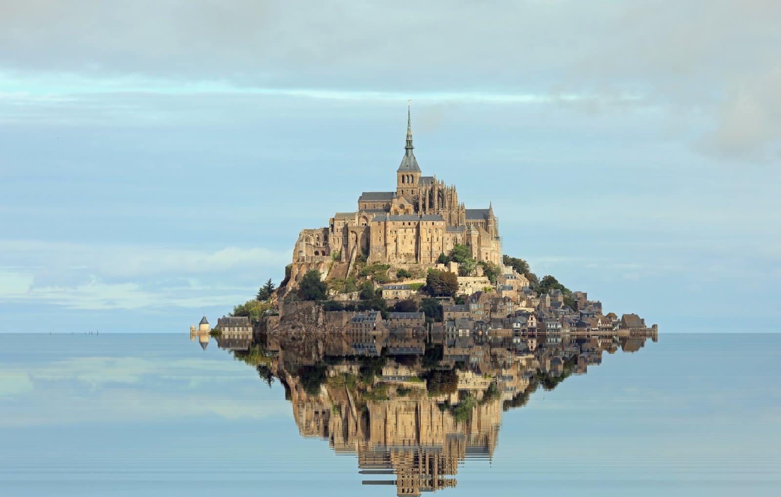Image Credit: Shutterstock / ChiccoDodiFC <p>Mont Saint-Michel, a mystical island commune, becomes an enchanting sight at high tide, surrounded by the shimmering waters of Normandy.</p>