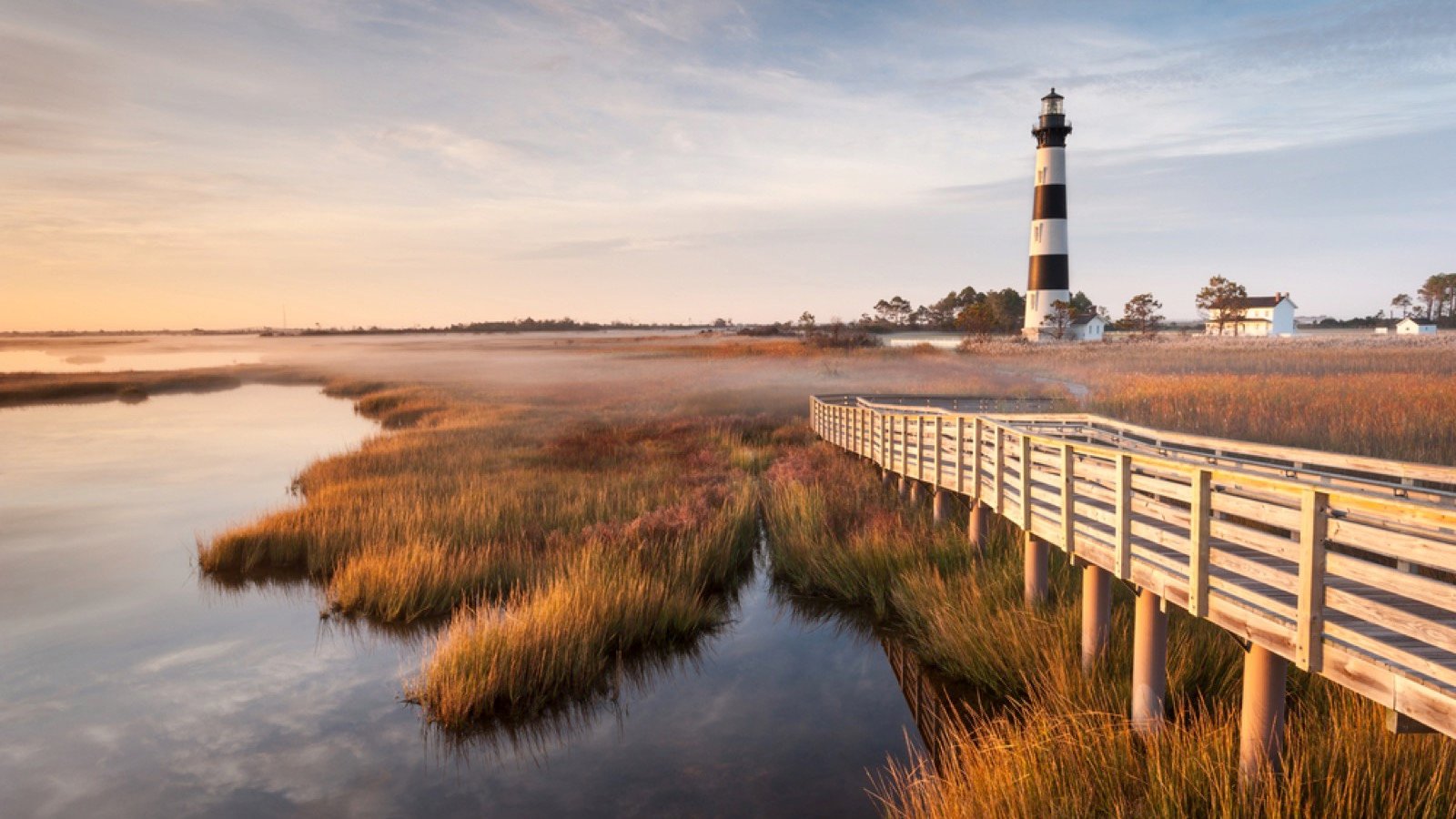 <p>The coast of North Carolina offers this 130-mile road trip, starting in Kitty Hawk and ending at Ocracoke Island. You’ll discover scenic barrier islands and historic lighthouses like Cape Hatteras and the Bodie Island Lighthouse.</p><p>Jockey’s Ridge State Park offers stunning scenery with its towering dunes and the historic Elizabethan Gardens in Manteo. Along the route, indulge your taste buds at restaurants such as The Mad Crabber, Kill Devil Grill, and Owens’ Restaurant, all located in towns along the route.</p>