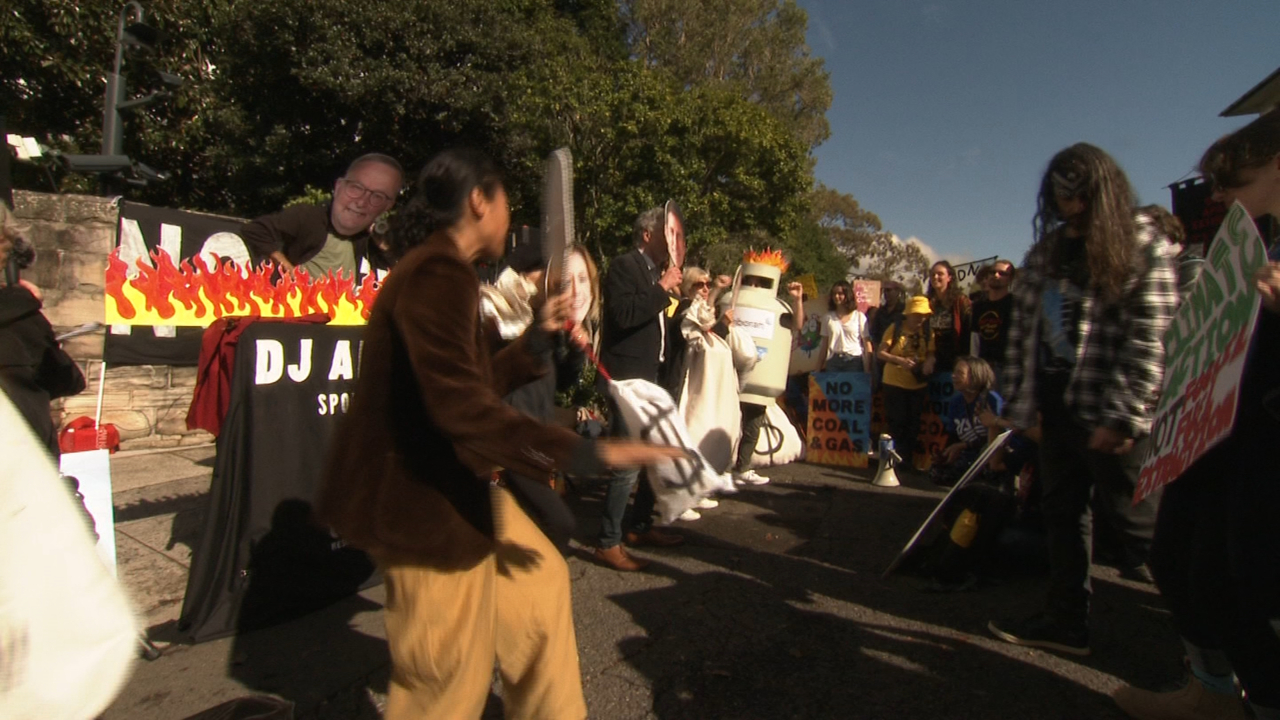 climate protesters rally outside kirribilli house