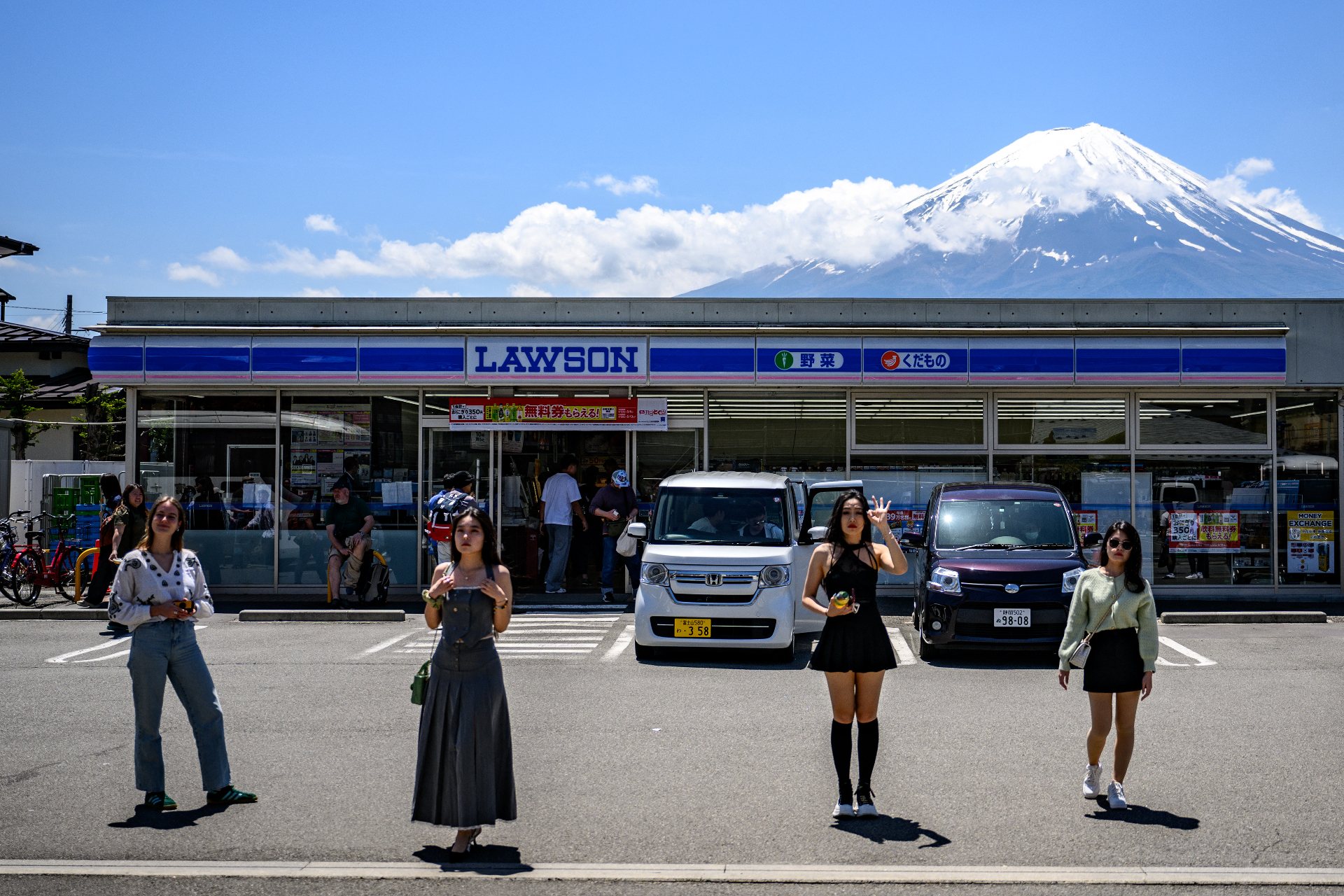 <p>The mesh net wall will cover the mountain view behind a Lawson convenience store, an ordinary staple in Japanese cities. According to The Guardian, combining both made it a viral photo spot.</p>