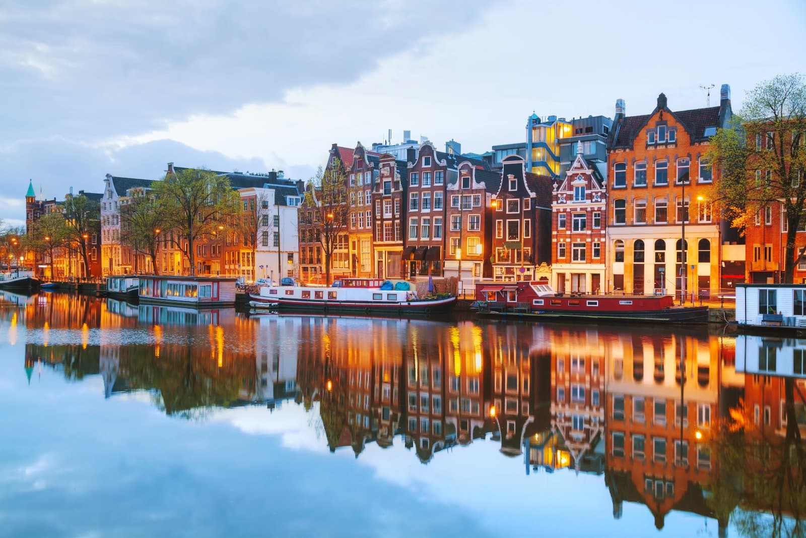 Image Credit: Shutterstock / photo.ua <p>Immerse yourself in Amsterdam’s laid-back atmosphere. Spend mornings cycling along picturesque canals, browsing flower markets, and sampling Dutch delicacies like stroopwafels and herring. Explore the city’s cultural scene with visits to museums like the Van Gogh Museum and Rijksmuseum and evenings enjoying live music in cozy cafes and bars.</p>