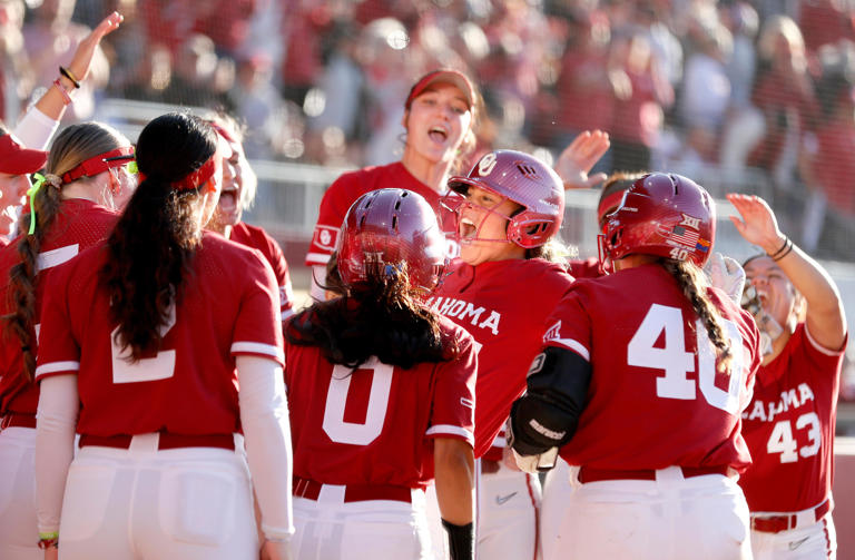 Oklahoma's Jayda Coleman (24) celebrates a home run in the second inning of the college softball game between the University of Oklahoma Sooners and BYU Cougars at Love's Field in Norman, Okla., Thursday, April 11, 2024.
