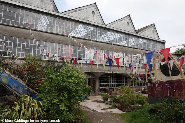 inside derelict glastonbury 'shanty town' factory overrun by 'hippies'