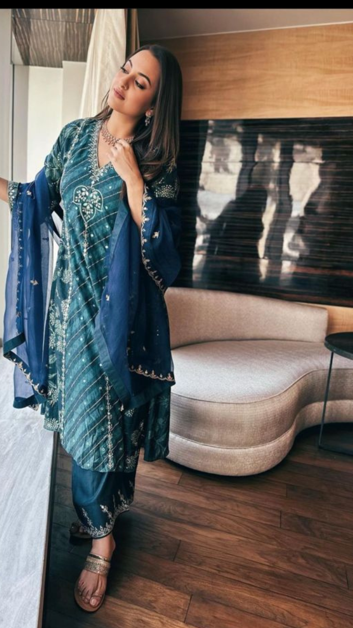 <p> A beautiful shot of Sonakshi, and a beautiful sofa in the background. The white sofa behind looks perfect and really adds up to the aesthetic of the space. From the brown, wooden floor to the chic white sofa, the decor is mind-blowing. </p>