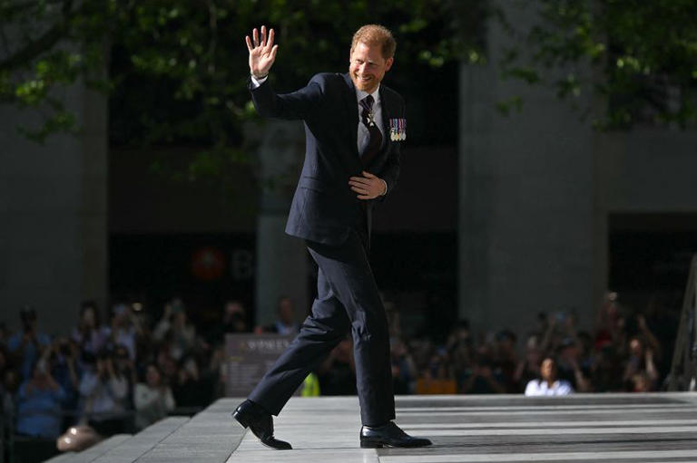 Prince Harry, Duke of Sussex waves as he arrives to attend a ceremony marking the 10th anniversary of the Invictus Games, at St Paul's Cathedral