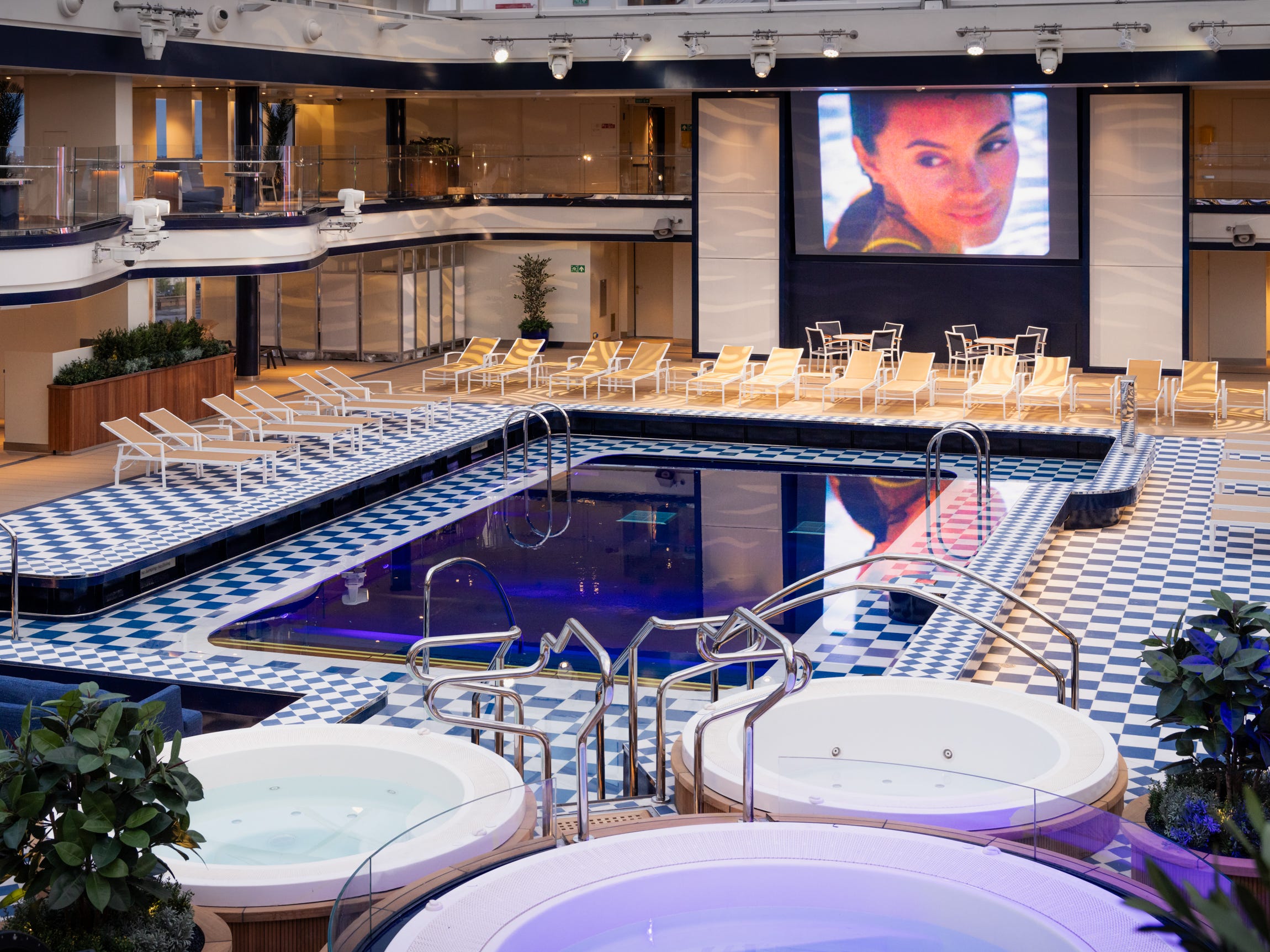 <p><span>For example, the Pavilion. It's one of Queen Anne's go-to places for an afternoon swim, nighttime movie viewing, silent disco, and not-so-silent live music, all under a retractable glass roof.</span></p><p>The ship's pool club also has plenty of lounge seats for a more <a href="https://www.insider.com/oceania-cruises-new-vista-ship-review-luxury-2023-10">traditional pool deck</a> experience. For something indoors, head to the drawing and game rooms instead. </p>