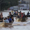 At least 100 dead and dozens still missing amid flooding in Brazil<br>