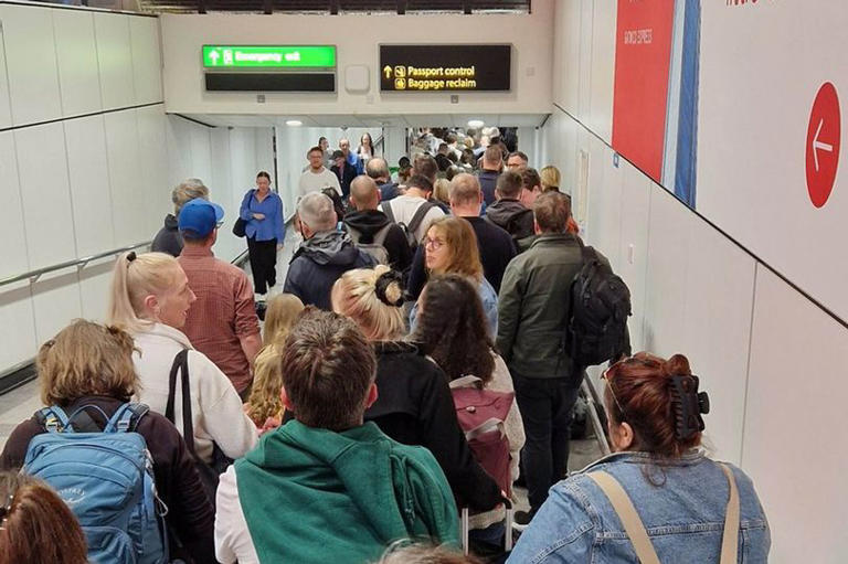Airports across the UK were affected by the issues. This handout photo was issued by Paul Uwagboe of Gatwick Airport at passport control