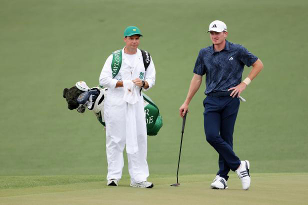 AUGUSTA, GEORGIA - APRIL 11: Nick Dunlap of the United States and his caddie, Hunter Hamrick, look on from the second green during the first round of the 2024 Masters Tournament at Augusta National Golf Club on April 11, 2024 in Augusta, Georgia. (Photo by Jamie Squire/Getty Images)