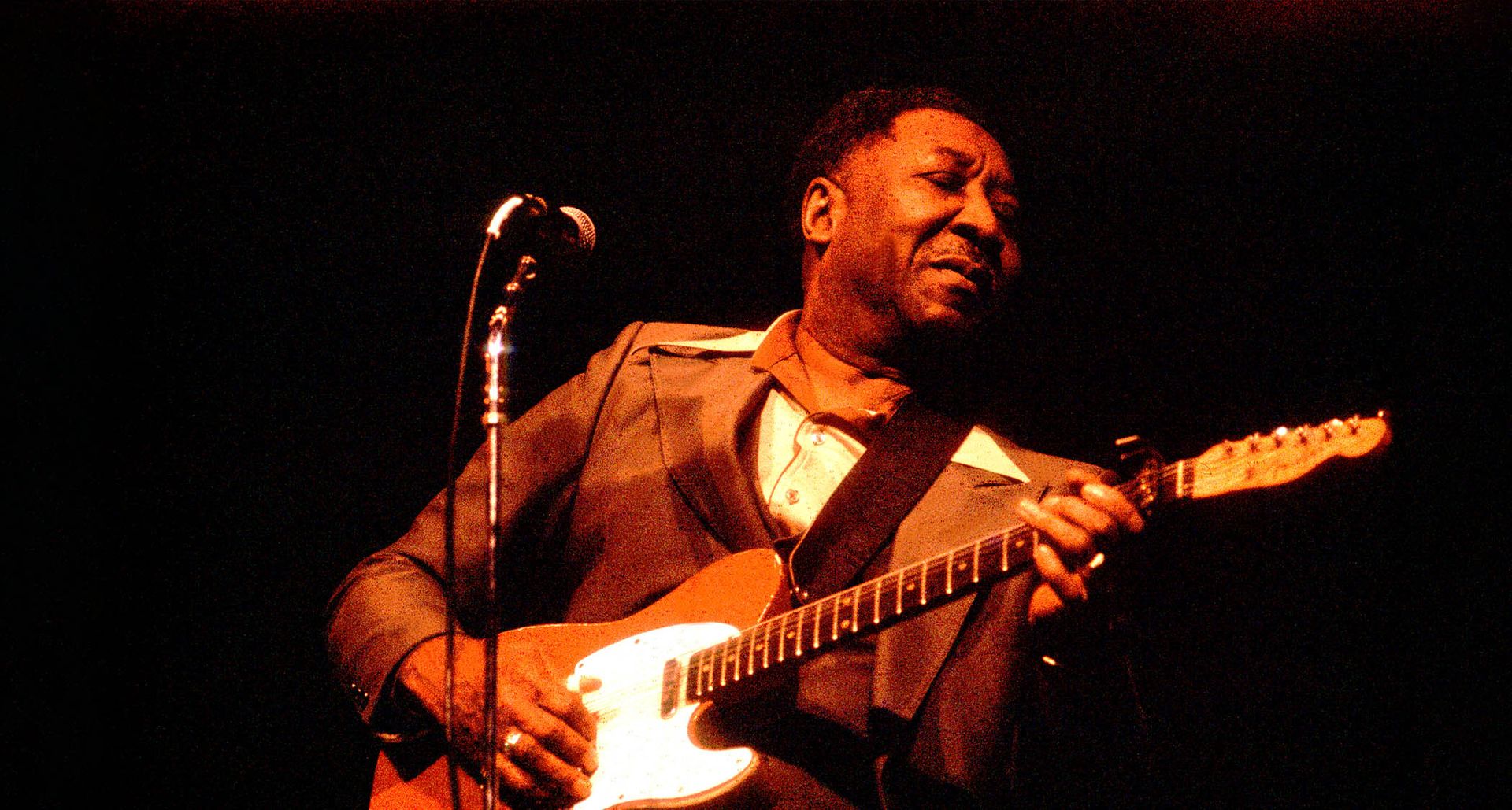 muddy waters is a blues guitar icon who pioneered the sound of electric guitar and invented a new solo language