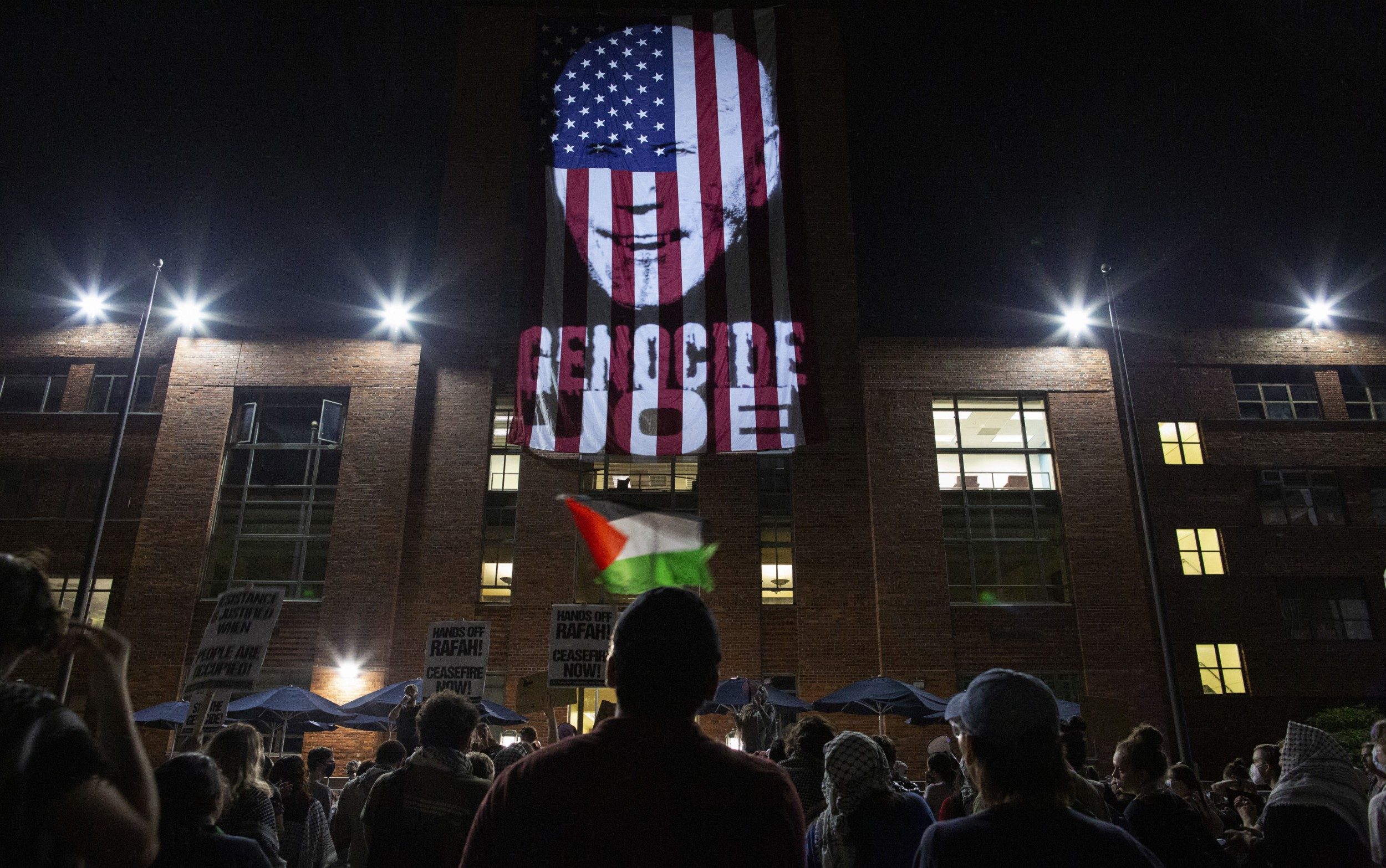 pro-palestine protesters project ‘student intifada’ slogan onto university building