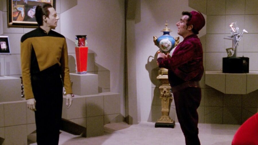 <p>Why is Picard mourning Data, and what the heck does Shakespeare’s Hamlet have to do with it? In “The Most Toys,” the android becomes the target of an amoral collector named Kivas Fajo. Knowing that Starfleet would hunt down anyone they knew had kidnapped Data, Fajo instead manages to fake the artificial officer’s death.</p><p>While we immediately see that Data is alive and in Fajo’s clutches, the Enterprise crew spends a good chunk of the episode believing that their colleague is dead. Picard takes the news particularly hard, and at one point, he picks up a book of Shakespearean drama that he had given Data and quotes the famous line from Hamlet. In case you were sleeping that day in English class, this quote is something Prince Hamlet says in remembrance of his late, great father.</p><p>By the end of the episode, Picard and the crew have rescued Data (thanks largely to Geordi La Forge figuring out that the android’s death was faked), meaning he can get his book back and enjoy Hamlet on his own time. As for fans, it’s hard to enjoy Picard’s heartfelt quote about his artificial colleague because the captain would end up seeing Data’s “like”–that is, characters with Data’s face–again and again.</p>