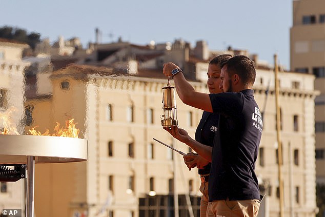 olympic flame arrives in france ahead of paris 2024 games