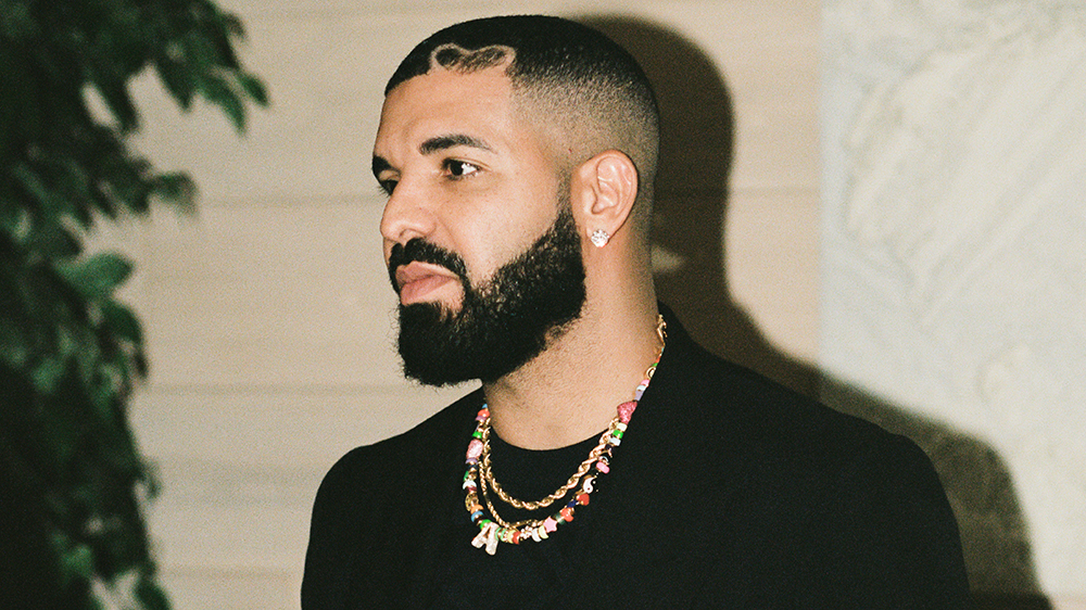 intruder arrested at drake's home a day after drive-by shooting