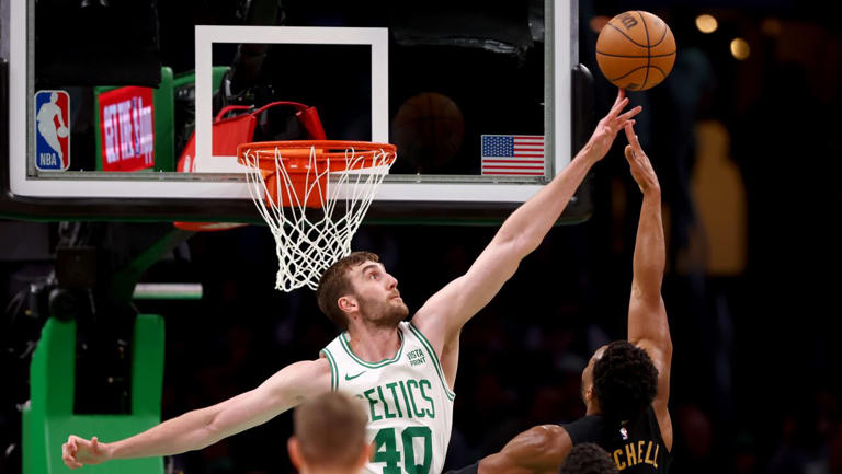 Luke Kornet #40 of the Boston Celtics blocks a shot from Donovan Mitchell #45 of the Cleveland Cavaliers during the first quarter in Game One of the Eastern Conference Second Round Playoffs at TD Garden.