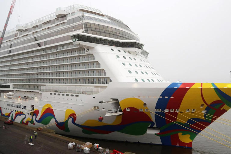 A Norwegian Cruise Line employee is in custody for allegedly stabbing multiple people with scissors aboard the ship Norwegian Encore on Monday during a cruise from Seattle to Alaska