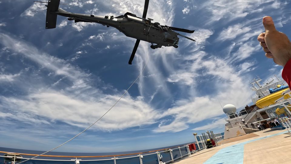 rescue team from us air force airlifts critically ill passenger from cruise ship in open atlantic waters