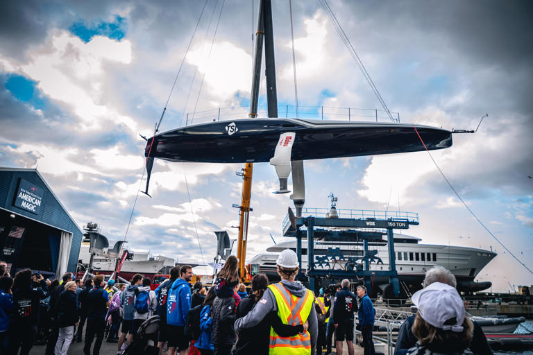 New York Yacht Club American Magic team members and family gather to view the christening of the new race boat, Patriot in Barcelona, Spain, on Tuesday May 7, 2024.