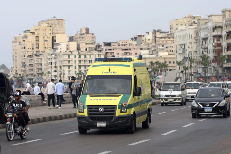 An ambulance leaves the the Pompey's Pillar site in the Mediterranean city of Alexandria, Egypt, Sunday, Oct. 8, 2023. An Egyptian policeman opened fire on Israeli tourists killing at least two Israelis and one Egyptian, Israeli and Egyptian authorities said. (AP Photo/Mostafa Hassan)